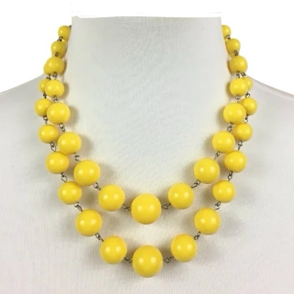 Yellow double-strand beaded statement necklace.